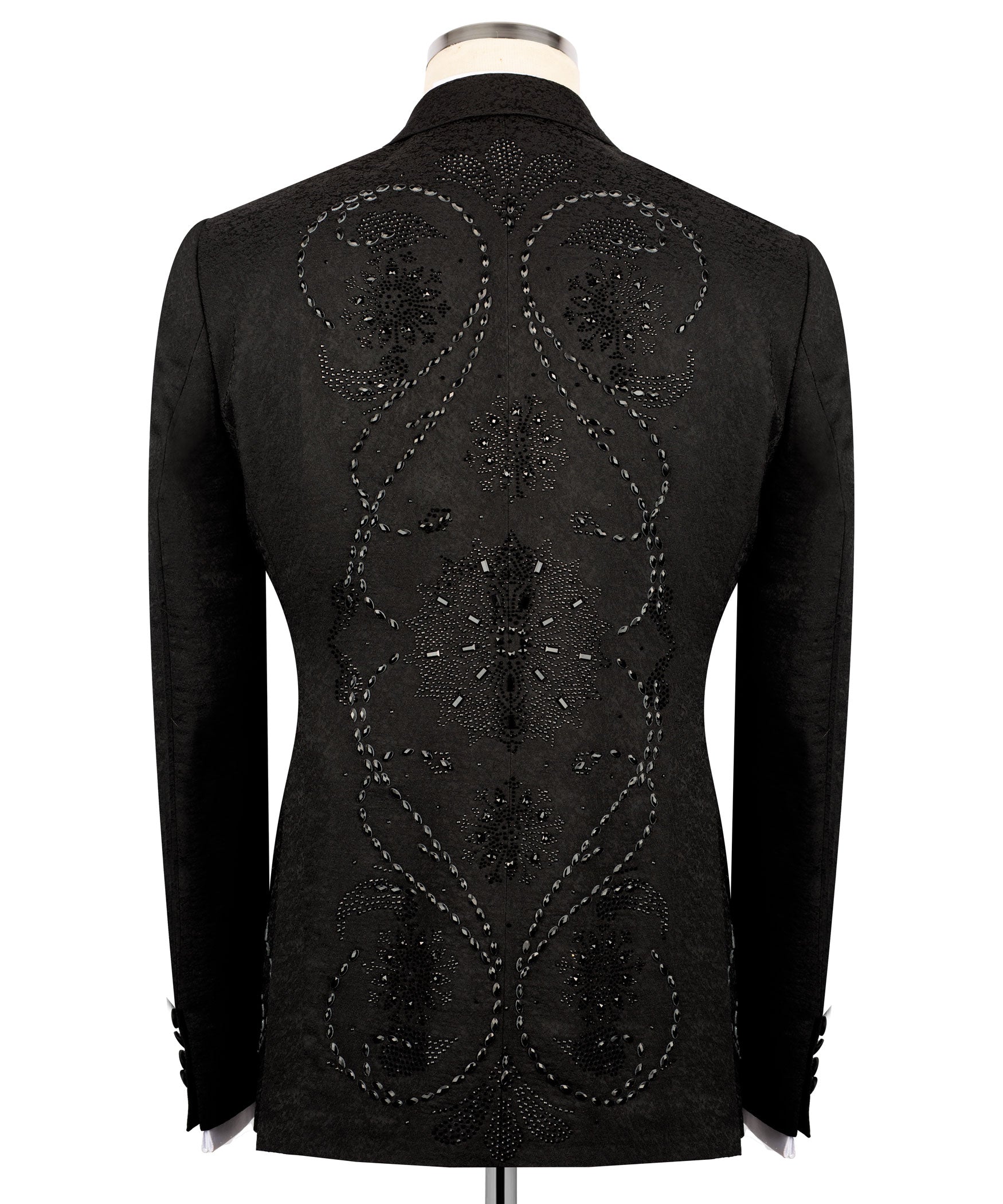 Back view of black embroidered tuxedo jacket with ornate circular and starburst motifs