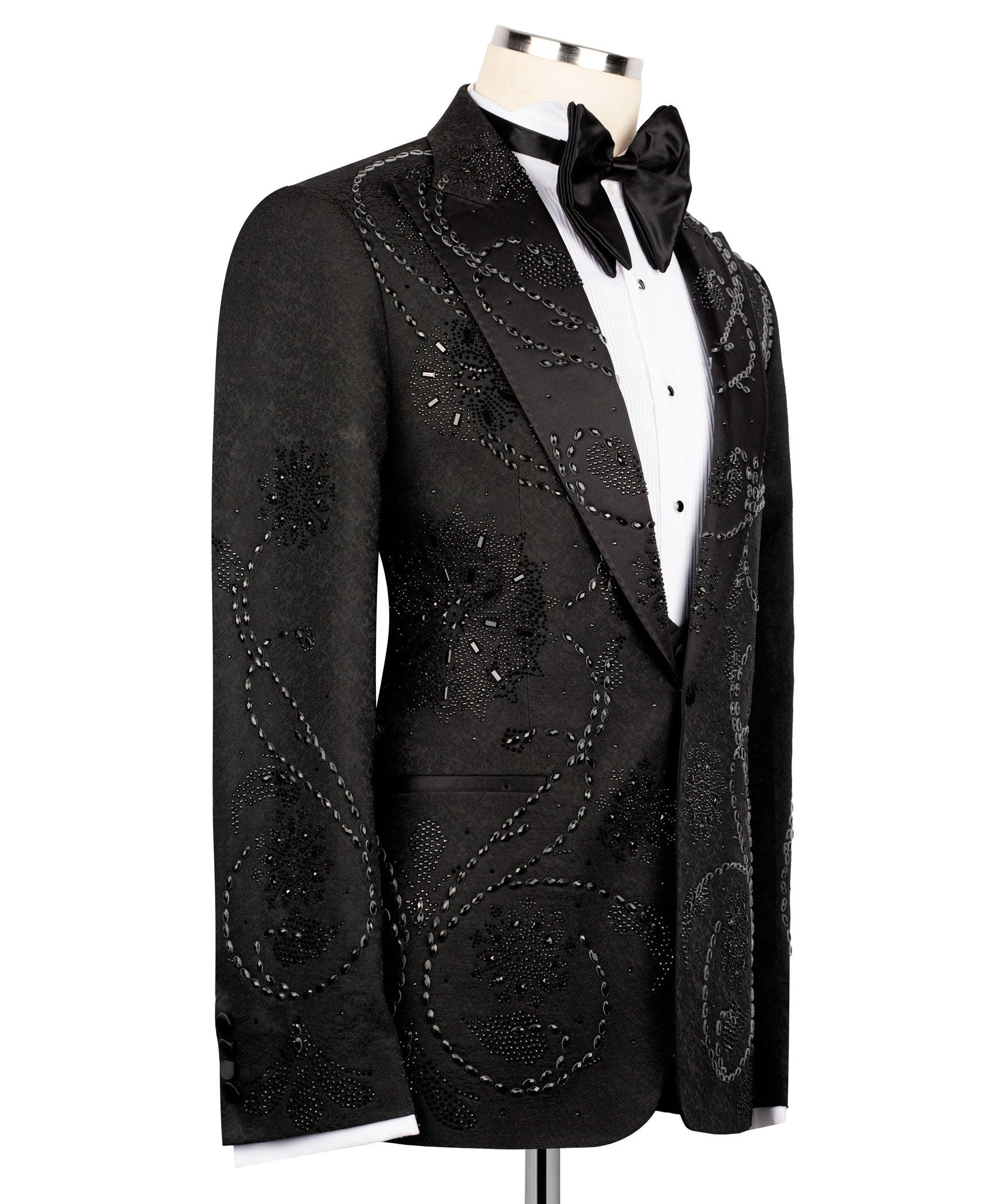 Black tuxedo jacket with embroidered front panels and satin bow tie at the collar