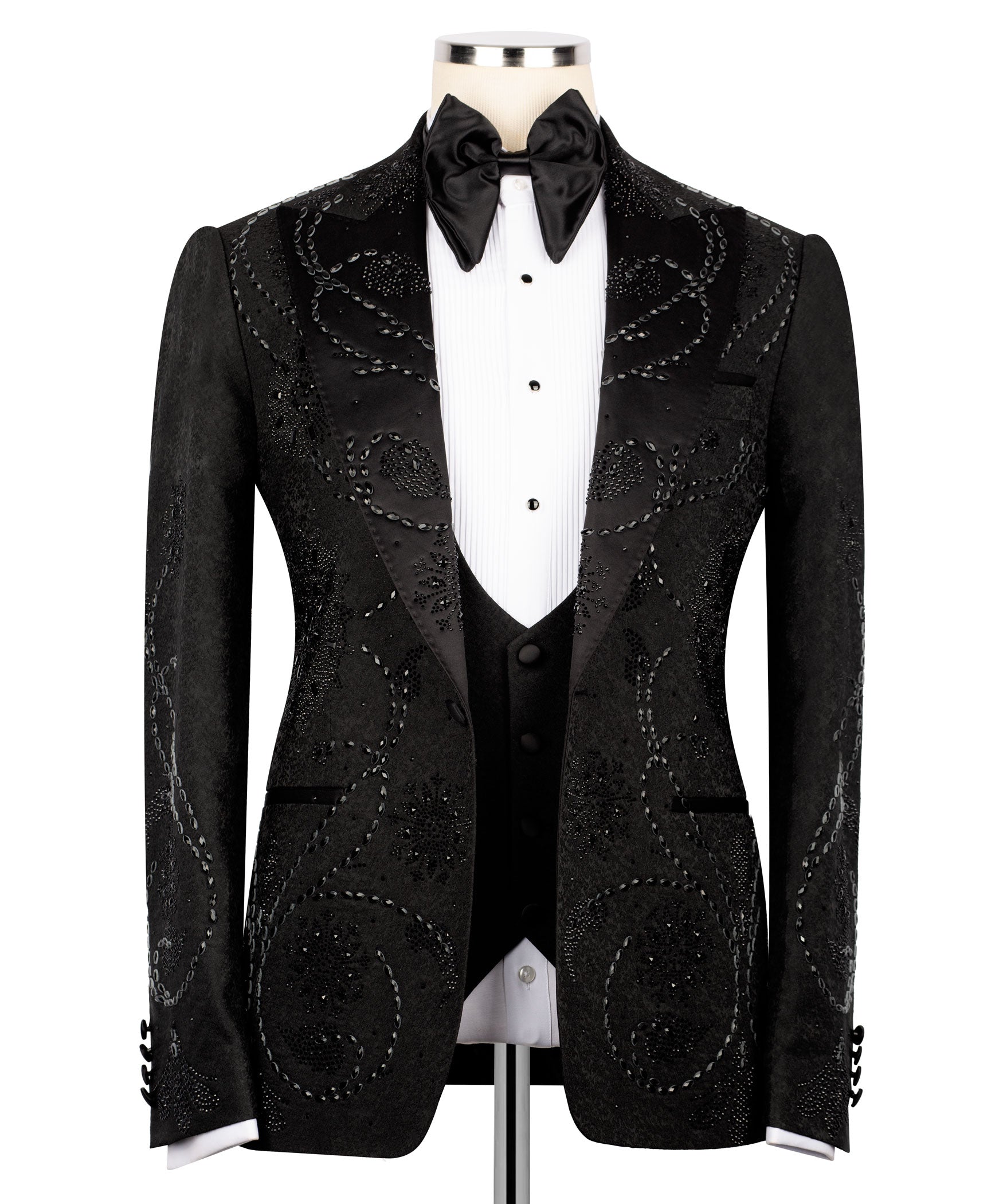 Black embellished tuxedo jacket with satin lapels, bow tie, and front button closure