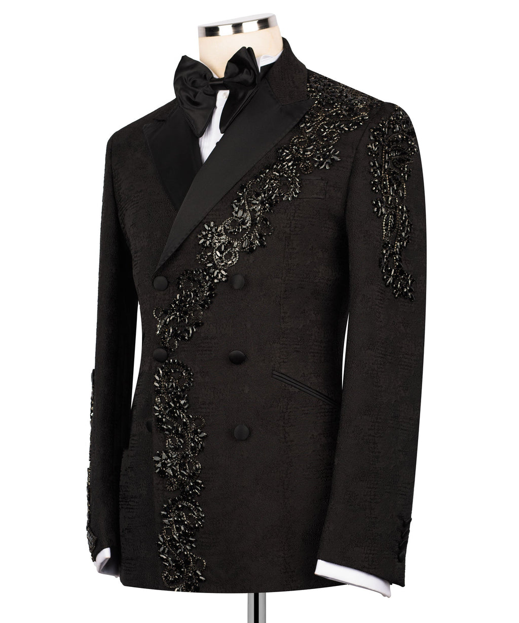 Black tuxedo jacket with black bow and ornate stone embroidery along placket