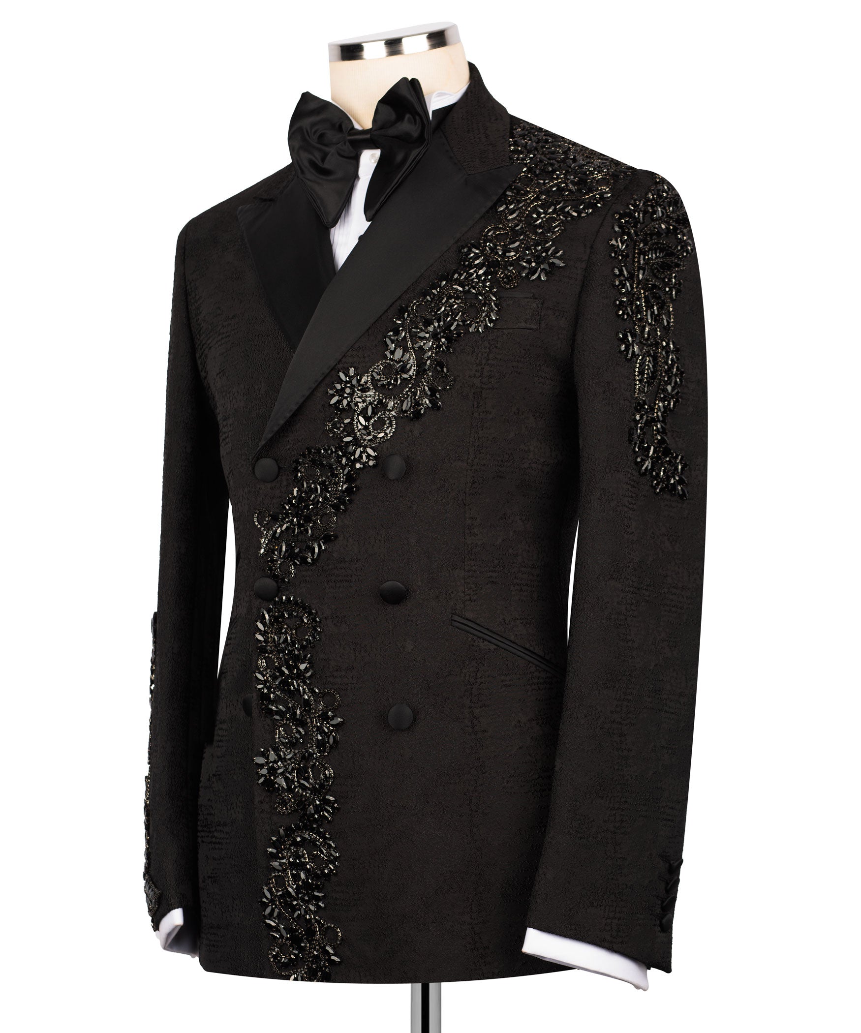 Black tuxedo jacket with black bow and ornate stone embroidery along placket
