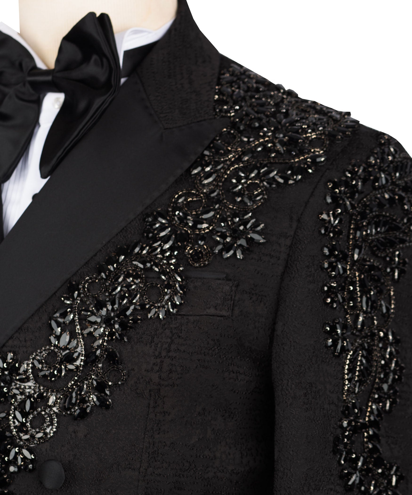 Close view of black tuxedo lapel with sparkling stone embroidery and buttons