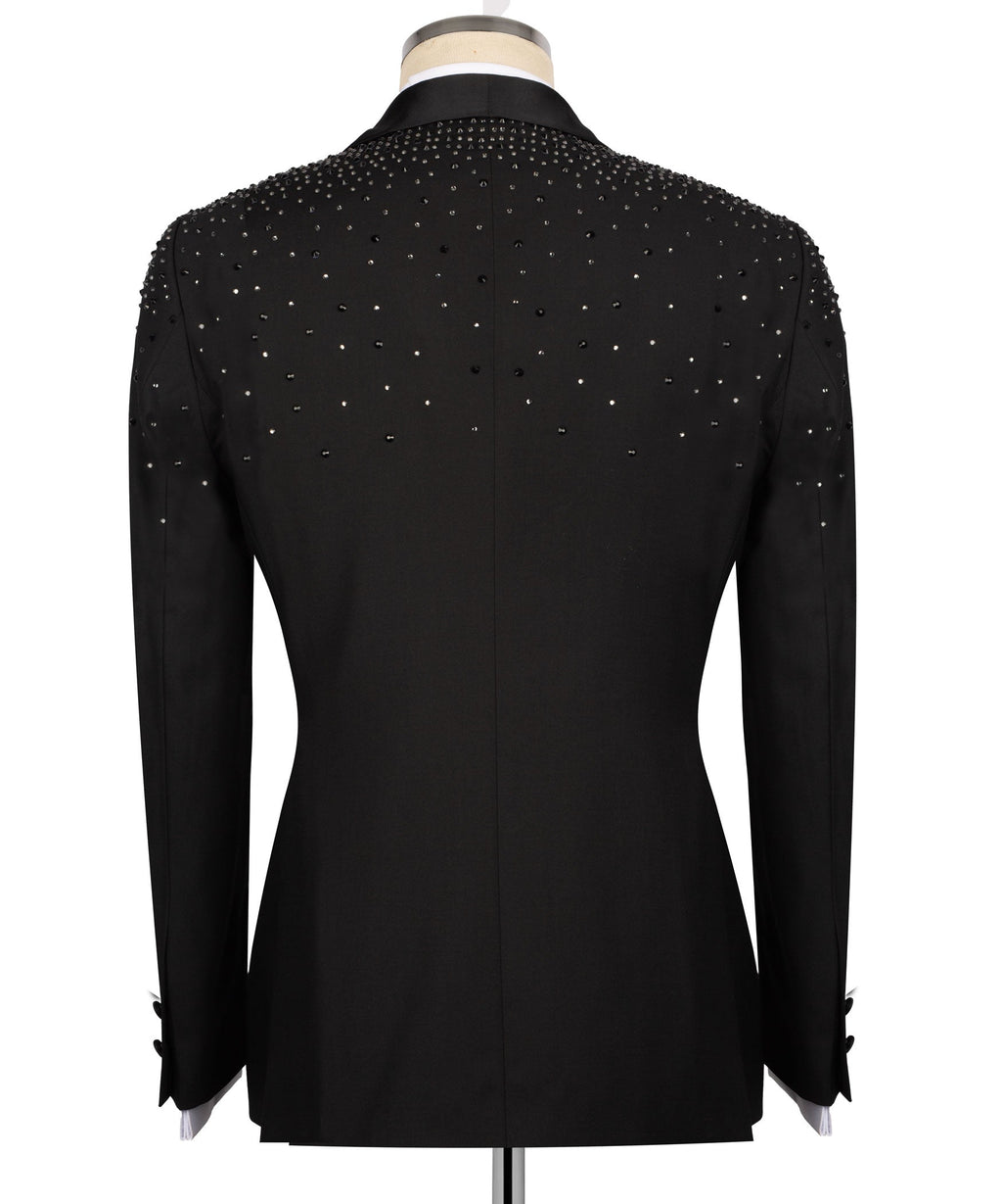Back view of black tuxedo jacket with rhinestone-studded shoulder line