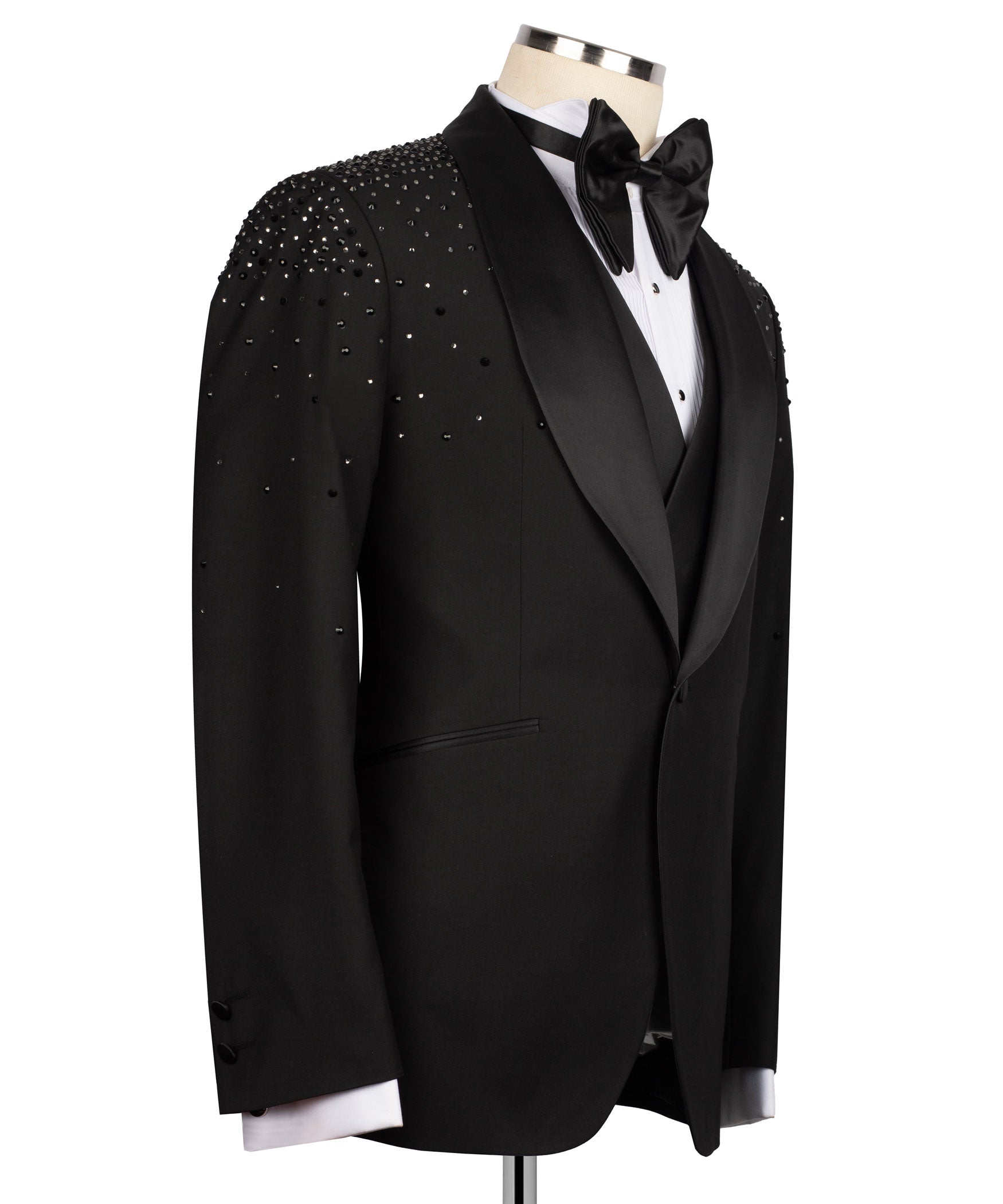 Black tuxedo jacket side view with rhinestone-studded shoulders and satin bow
