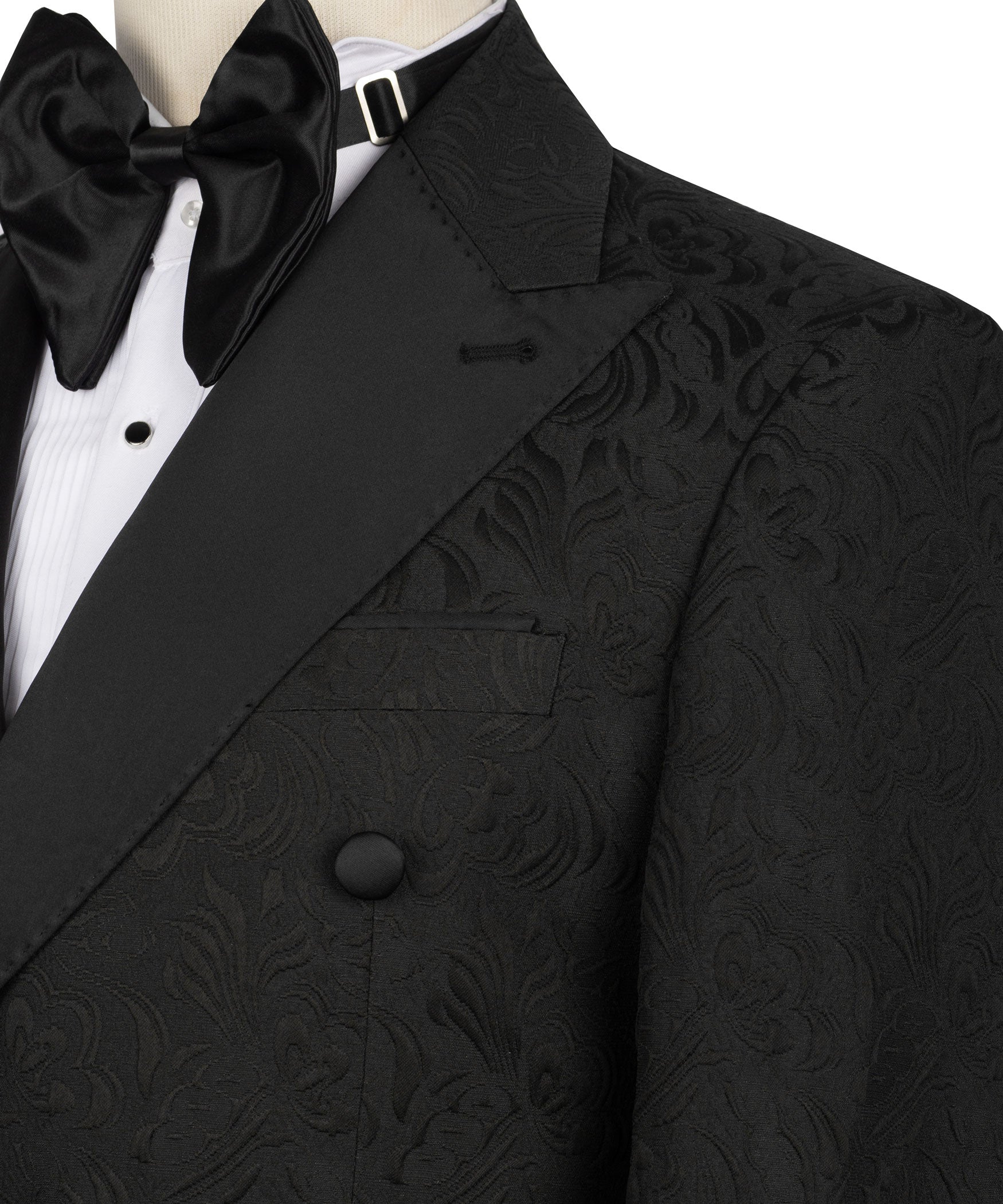 Close-up of black bow tie and tuxedo lapel with double-breasted front and patterned weave