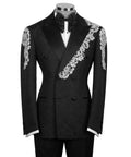 Black tuxedo jacket with stone-embroidered floral trim, satin bow tie, vest