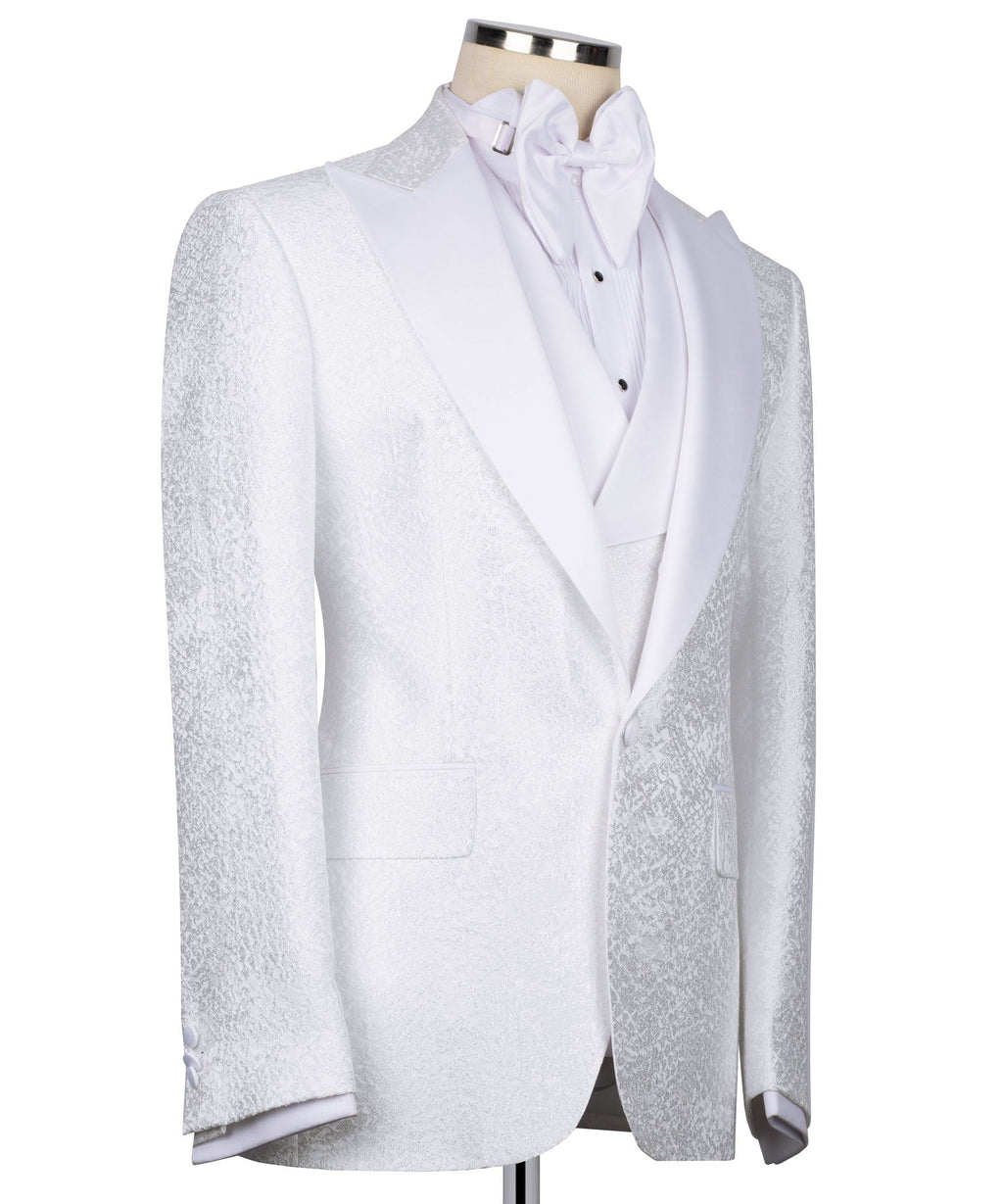 White tuxedo suit jacket with textured front panels, satin bow tie, and vest