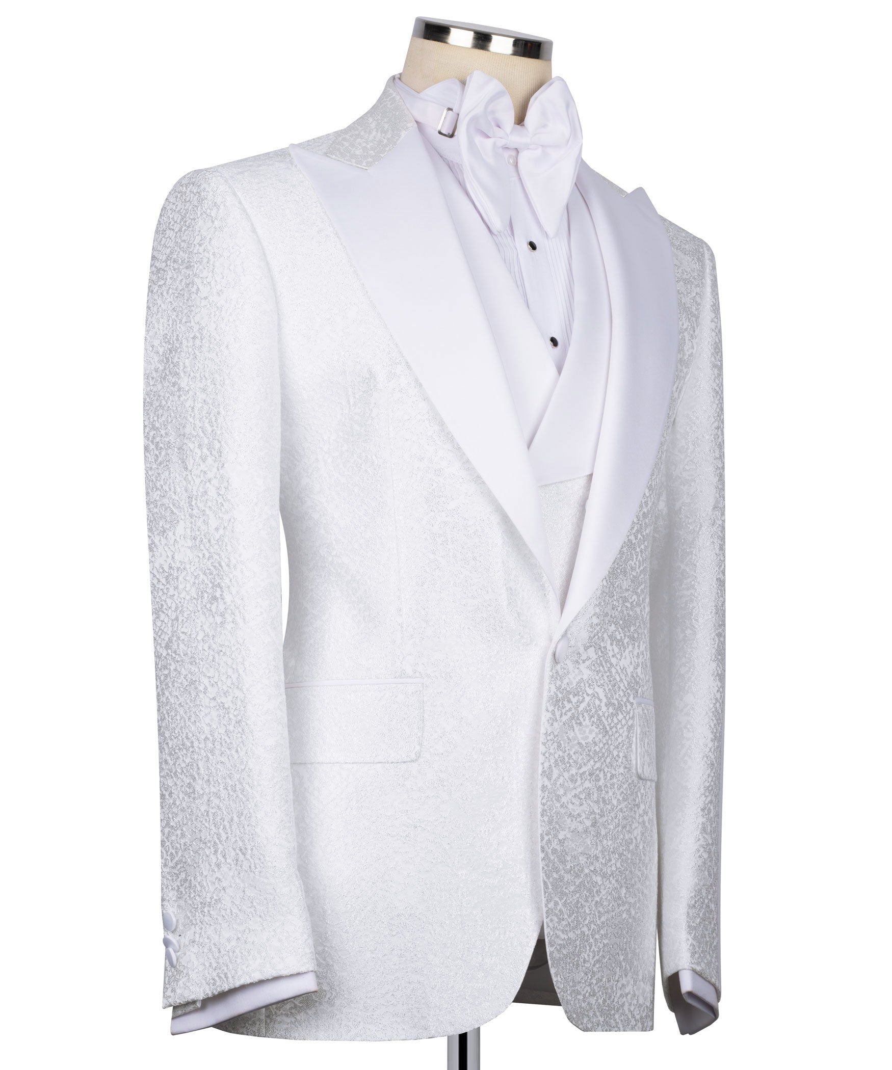 White tuxedo jacket front with embroidered trim, bow tie, and waistcoat