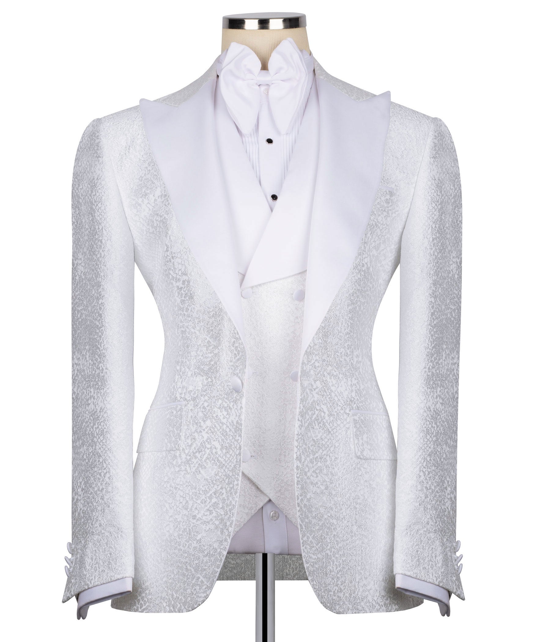 White tuxedo jacket with stone-embroidered lapels, bow tie, and matching vest