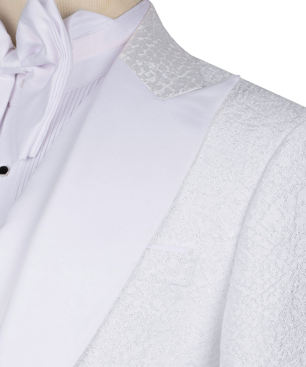 White dress shirt front with stone-embroidered jacket lapel and bow tie