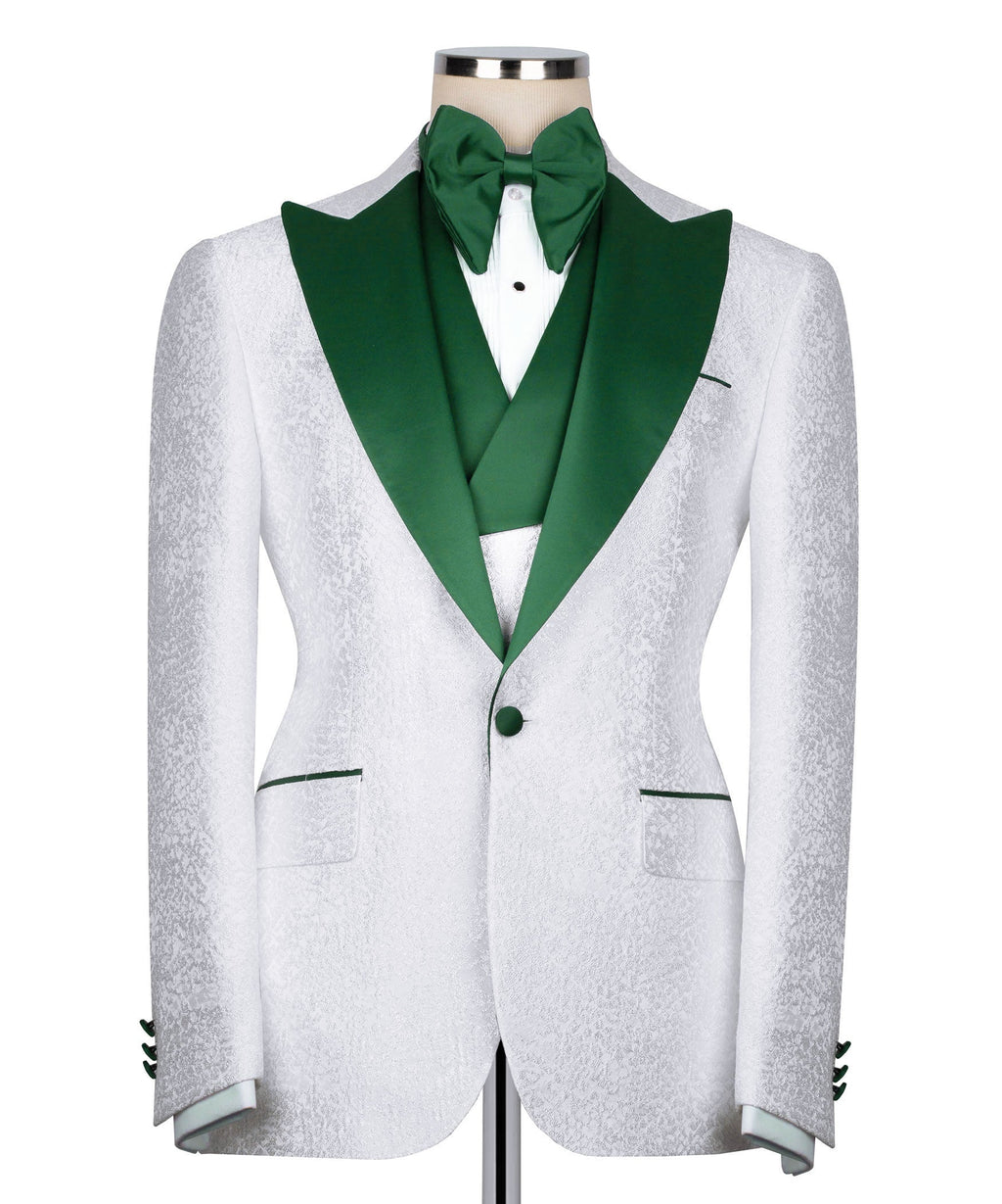White tuxedo jacket with green shawl collar, green bow tie, and green-lined waistcoat