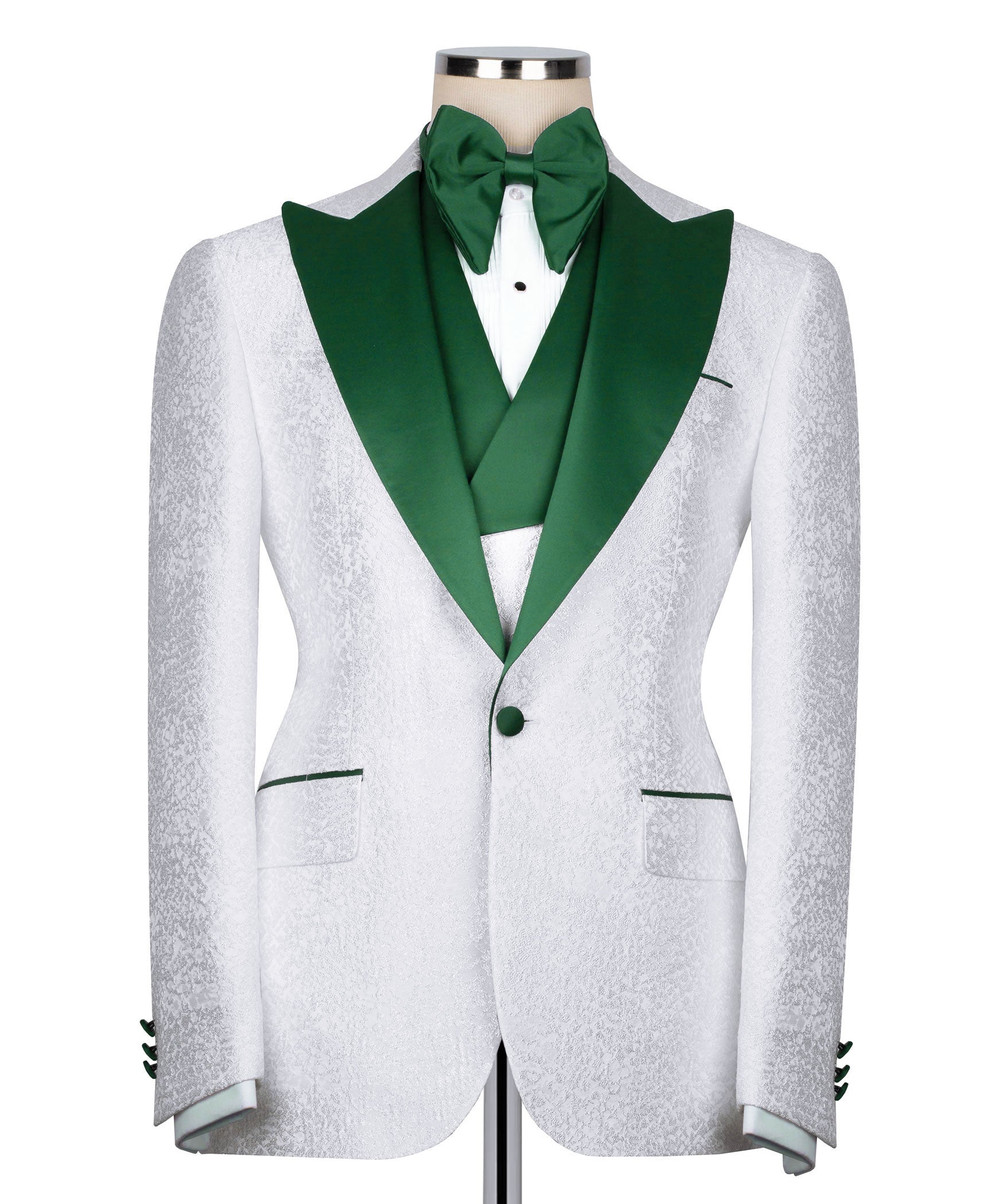 White tuxedo jacket with green shawl collar, green bow tie, and green-lined waistcoat