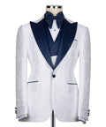 White tuxedo jacket with dark blue V-shaped lapels and single-button closure; tailored fit.