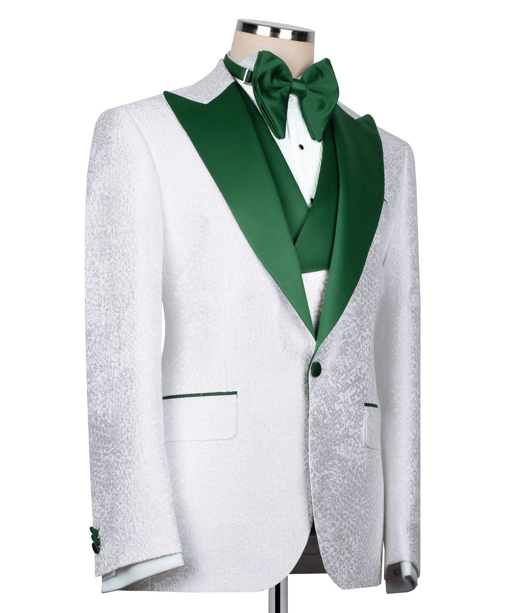 White tuxedo jacket with green satin shawl collar, green pocket accents, and green bow tie