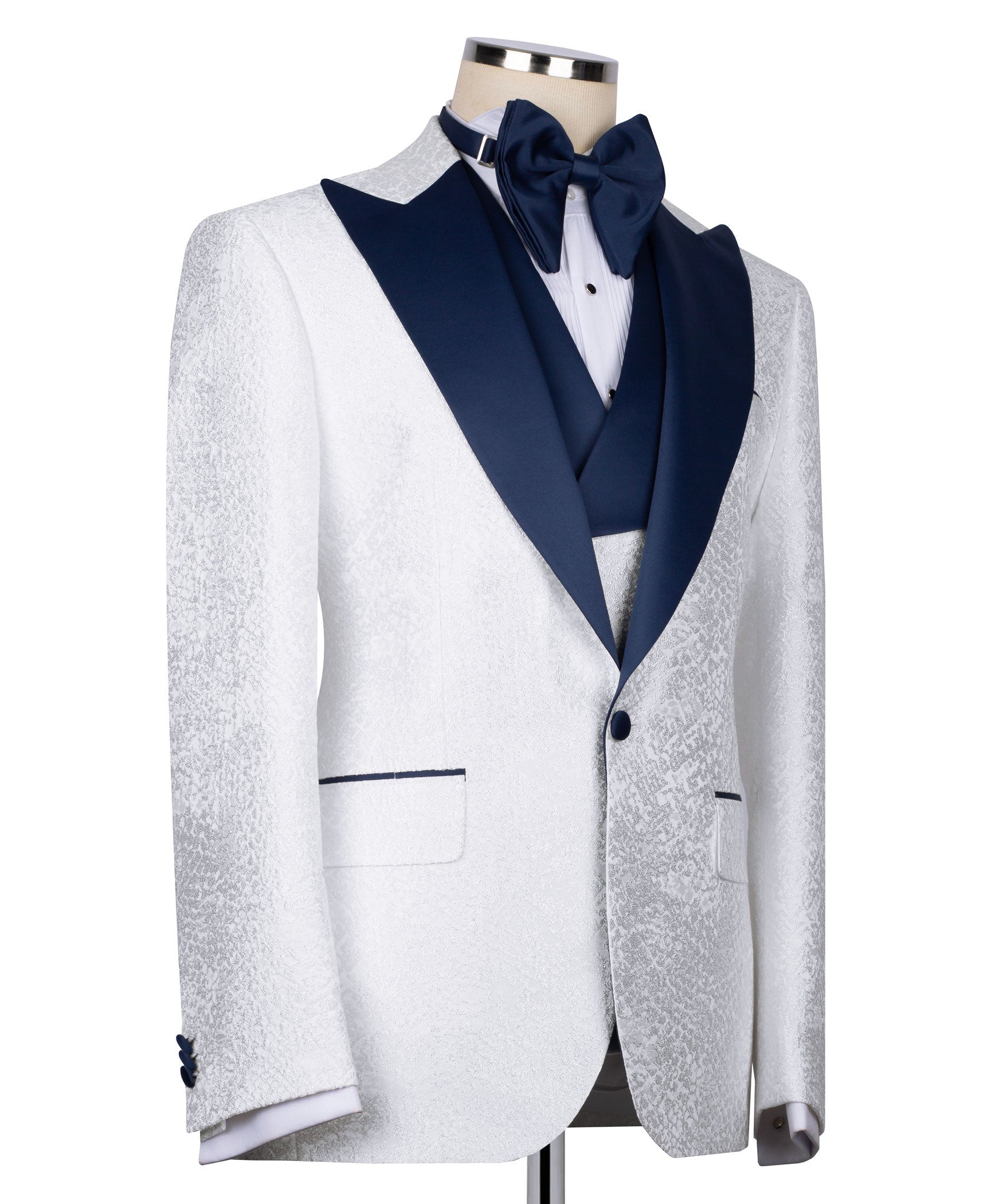 White tuxedo jacket with navy shawl collar, bow tie, and buttoned front