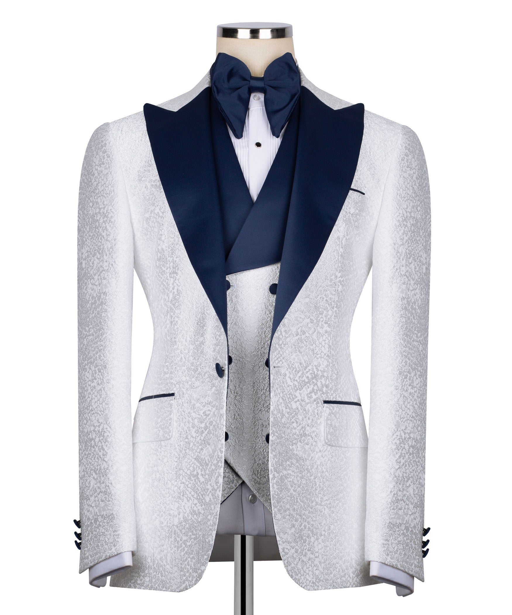 White tuxedo jacket, navy shawl collar and bow tie