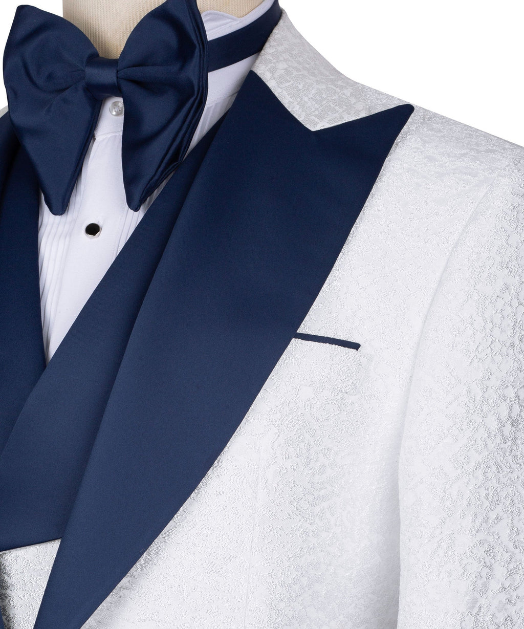 Navy bow tie and lapels with textured white tuxedo jacket