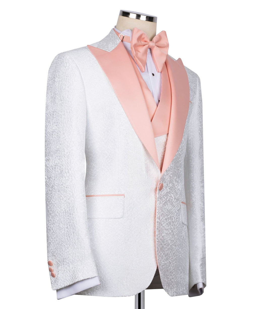 White tuxedo jacket side view with pale pink lapel, pocket trim, and pink-covered buttons