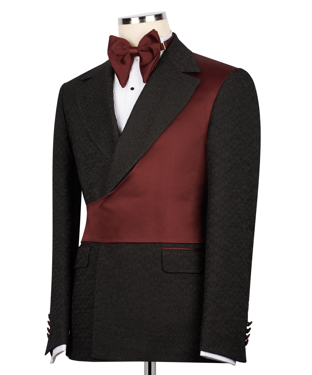 Black tuxedo jacket with maroon vest panel and burgundy bow tie, angled