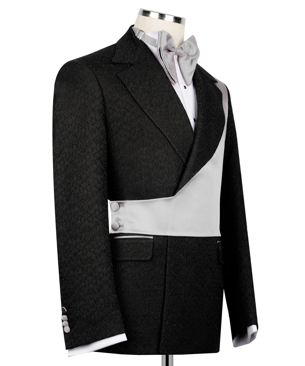 Black tuxedo jacket with light-gray satin vest, white shirt front, and bow tie
