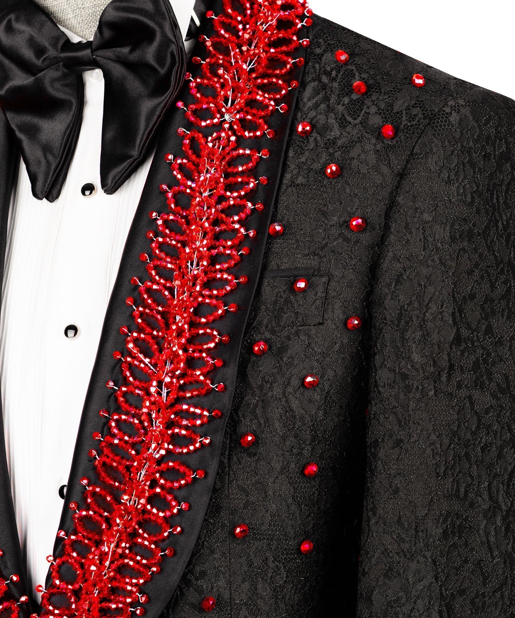 Red stone-embroidered vertical trim on black tuxedo lapel with bow tie