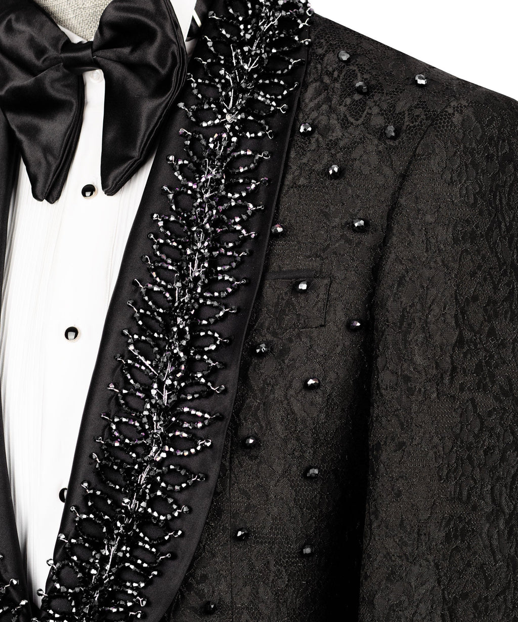 Close-up: black tuxedo lapel embroidery with bow tie and white shirt front