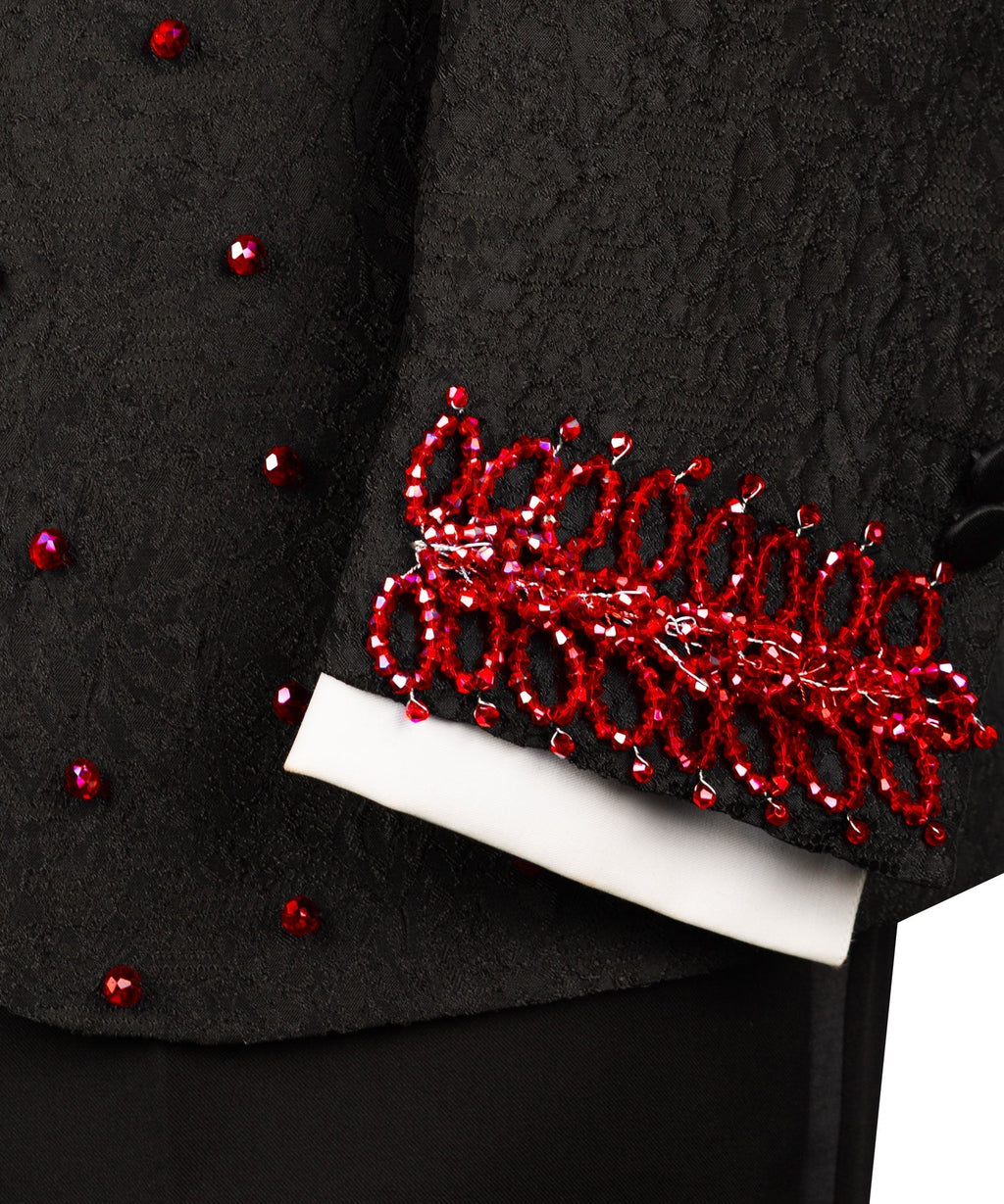 Black tuxedo cuff and hem with red stone-embroidered trim over white shirt