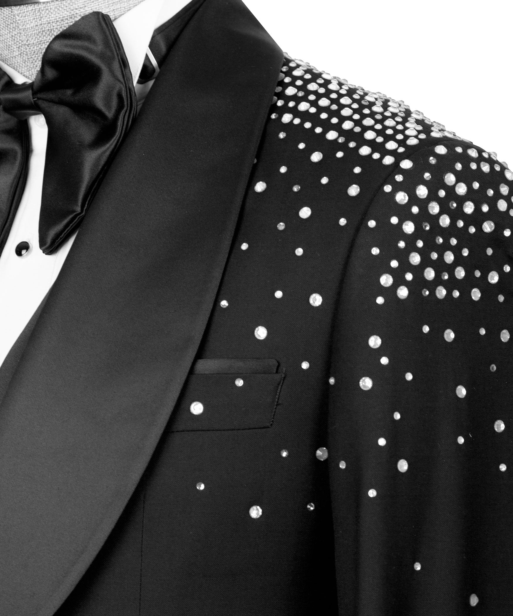 Close-up: black bow tie and lapel with silver studded dotted fabric