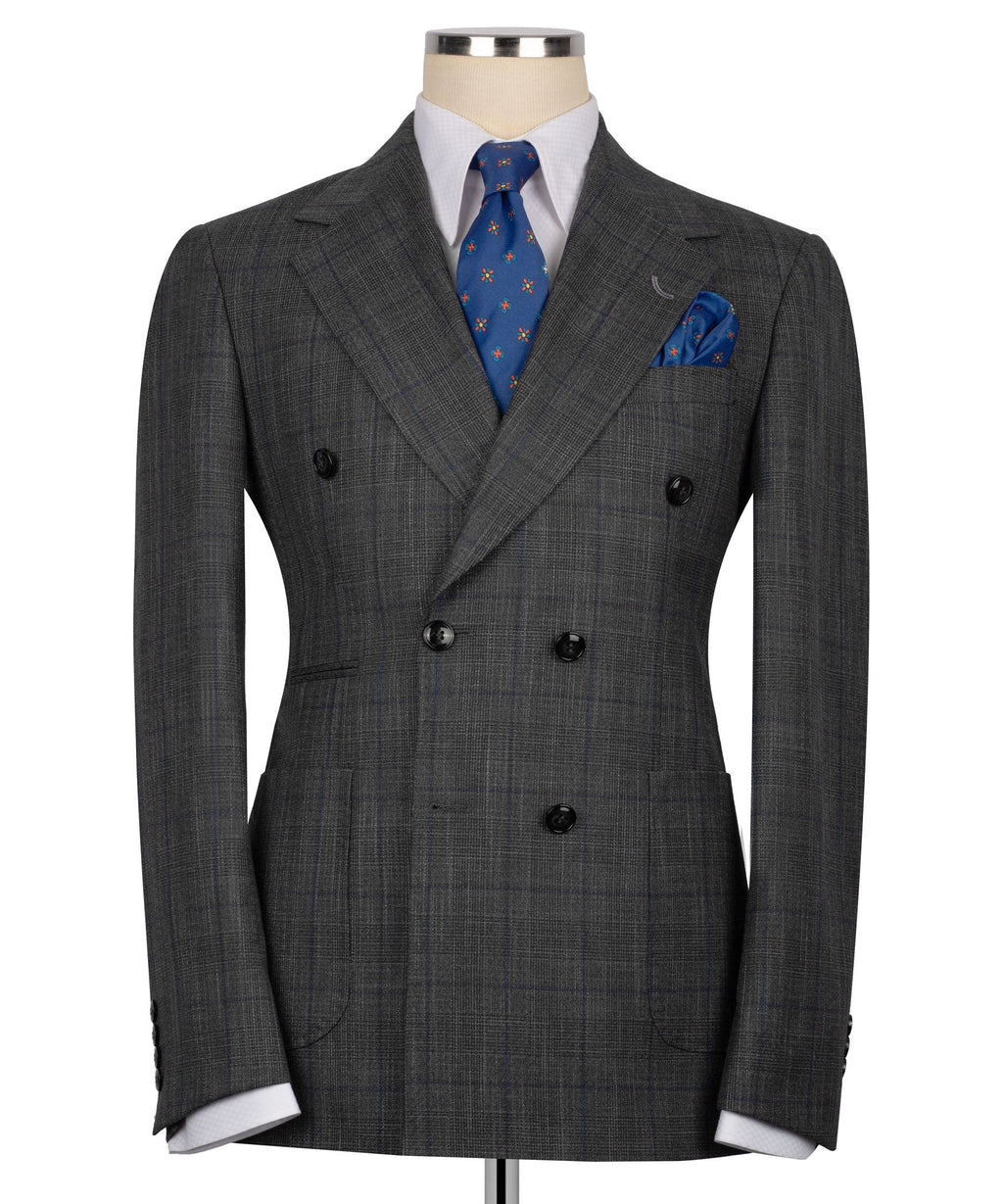 Dark gray plaid double-breasted suit jacket, black buttons, blue tie and pocket square