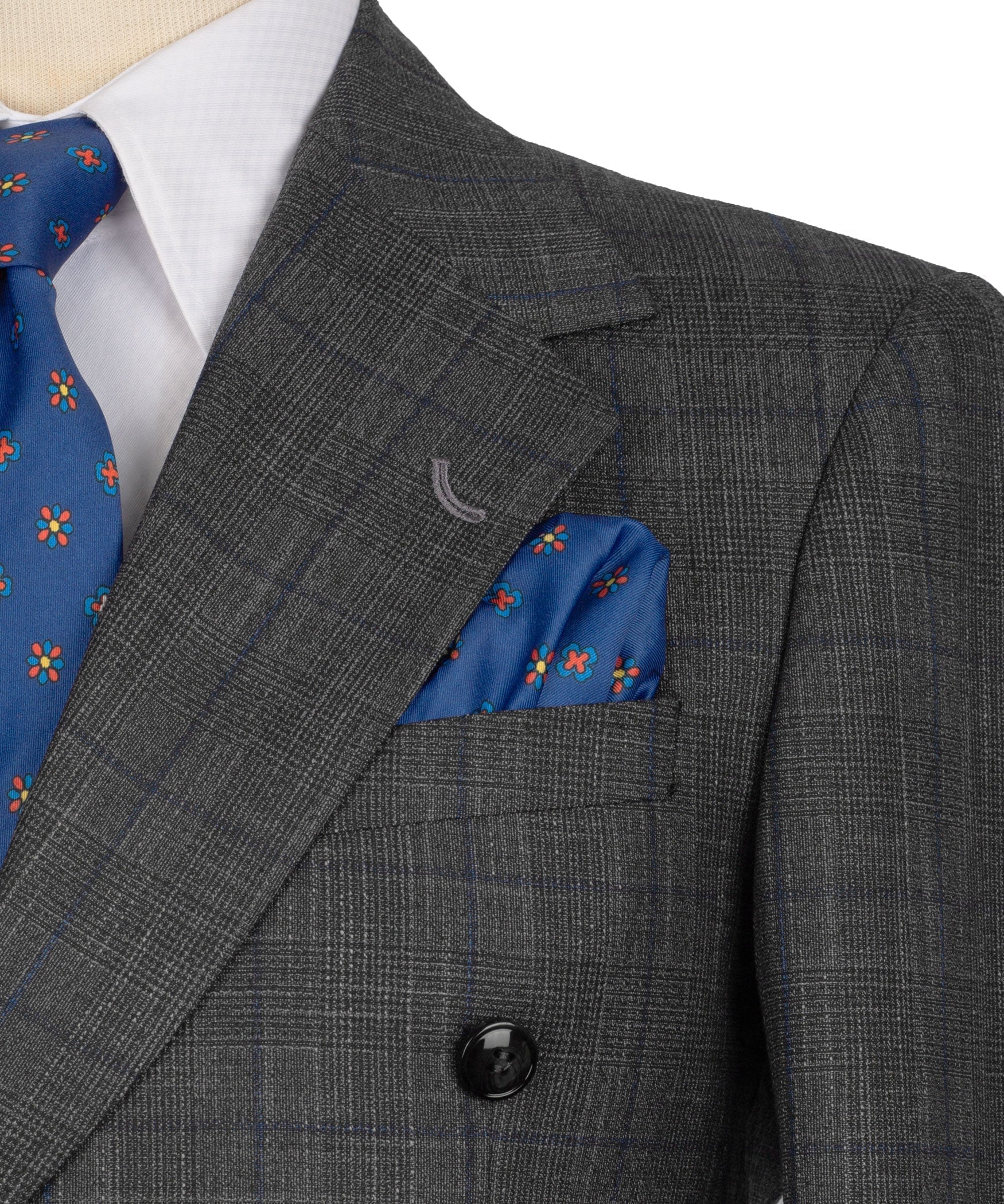 Dark gray plaid suit jacket shoulder and chest detail with blue pocket square