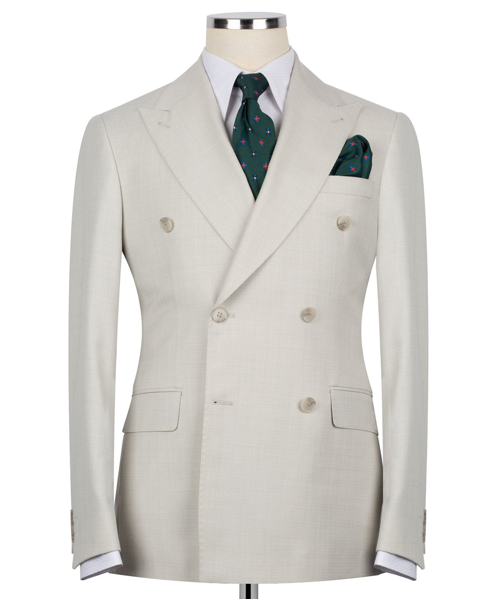 Beige double-breasted blazer with notch lapels, four-button front and pocket square
