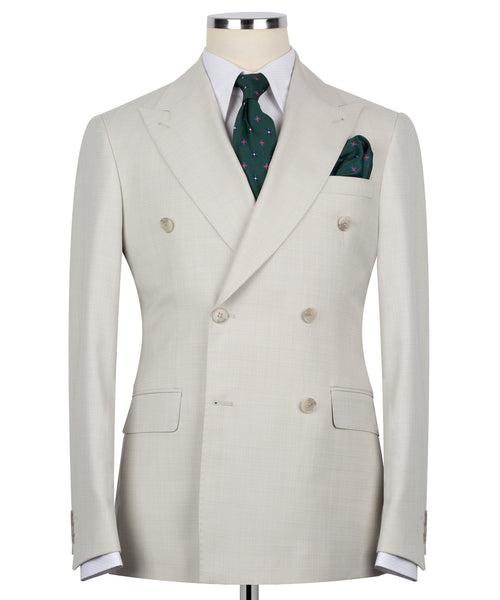Beige double-breasted blazer with notch lapels, four-button front and pocket square