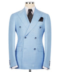 Light blue double-breasted suit jacket with notch lapels, flap pockets, and dark tie
