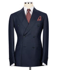 Navy double-breasted suit jacket with notch lapels, flap pockets, and green buttons