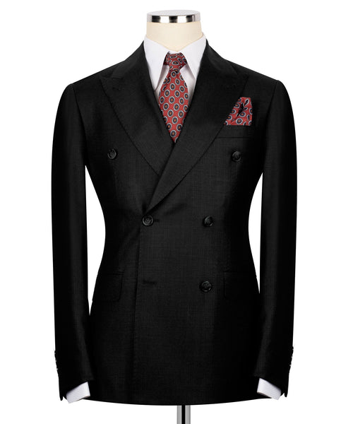 Black double-breasted blazer with patterned tie and red patterned pocket square