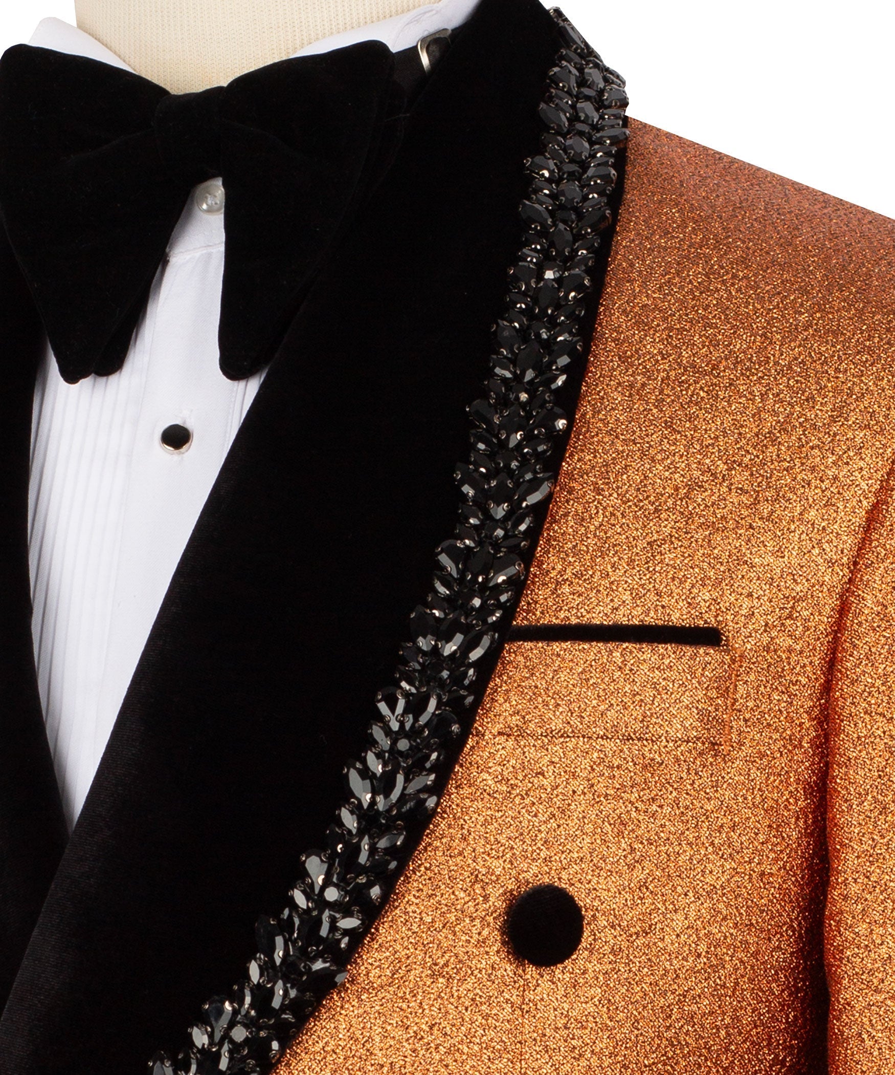 Close-up: black velvet bow and beaded trim along the gold tuxedo jacket