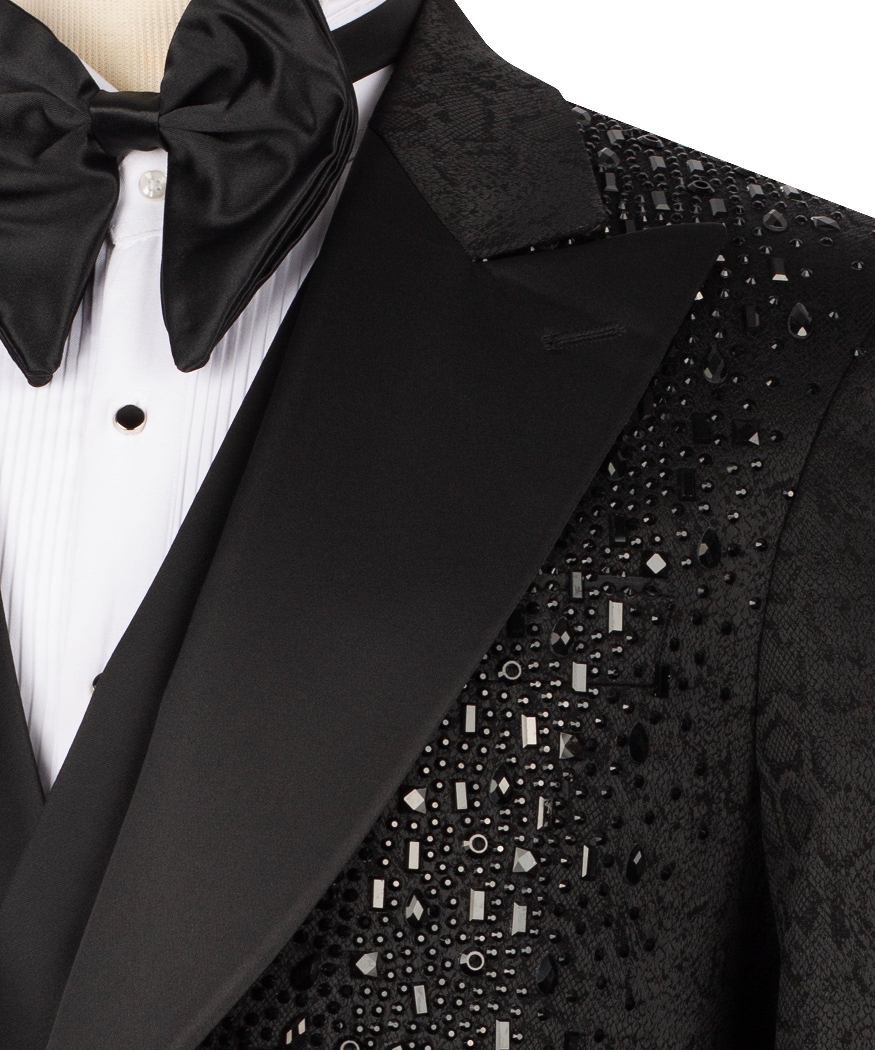 Close-up: black tuxedo lapel with satin trim and stone-embellished embroidery