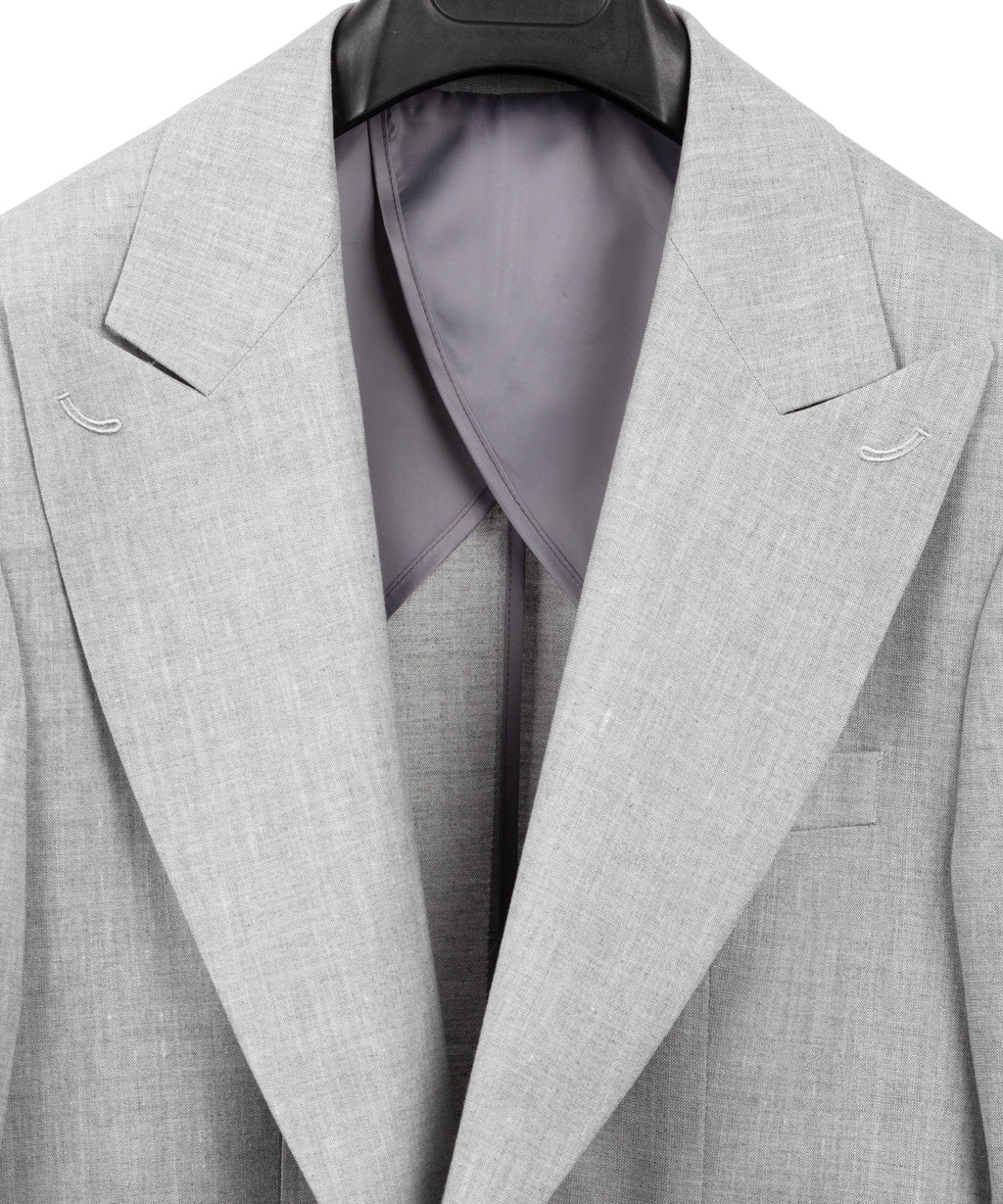 Light gray linen suit blazer with open front showing dark lining at the chest