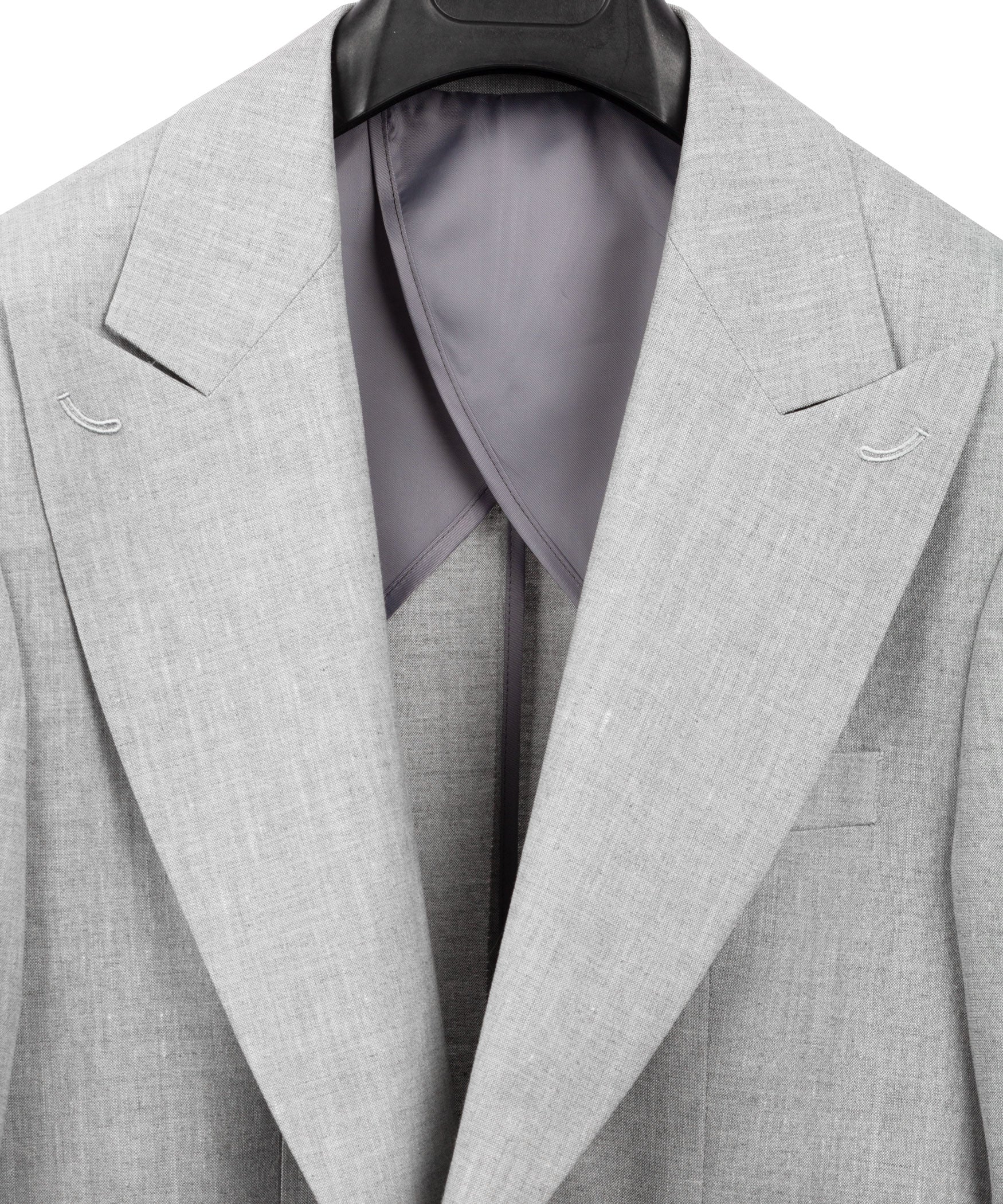 Light gray linen suit blazer with open front showing dark lining at the chest