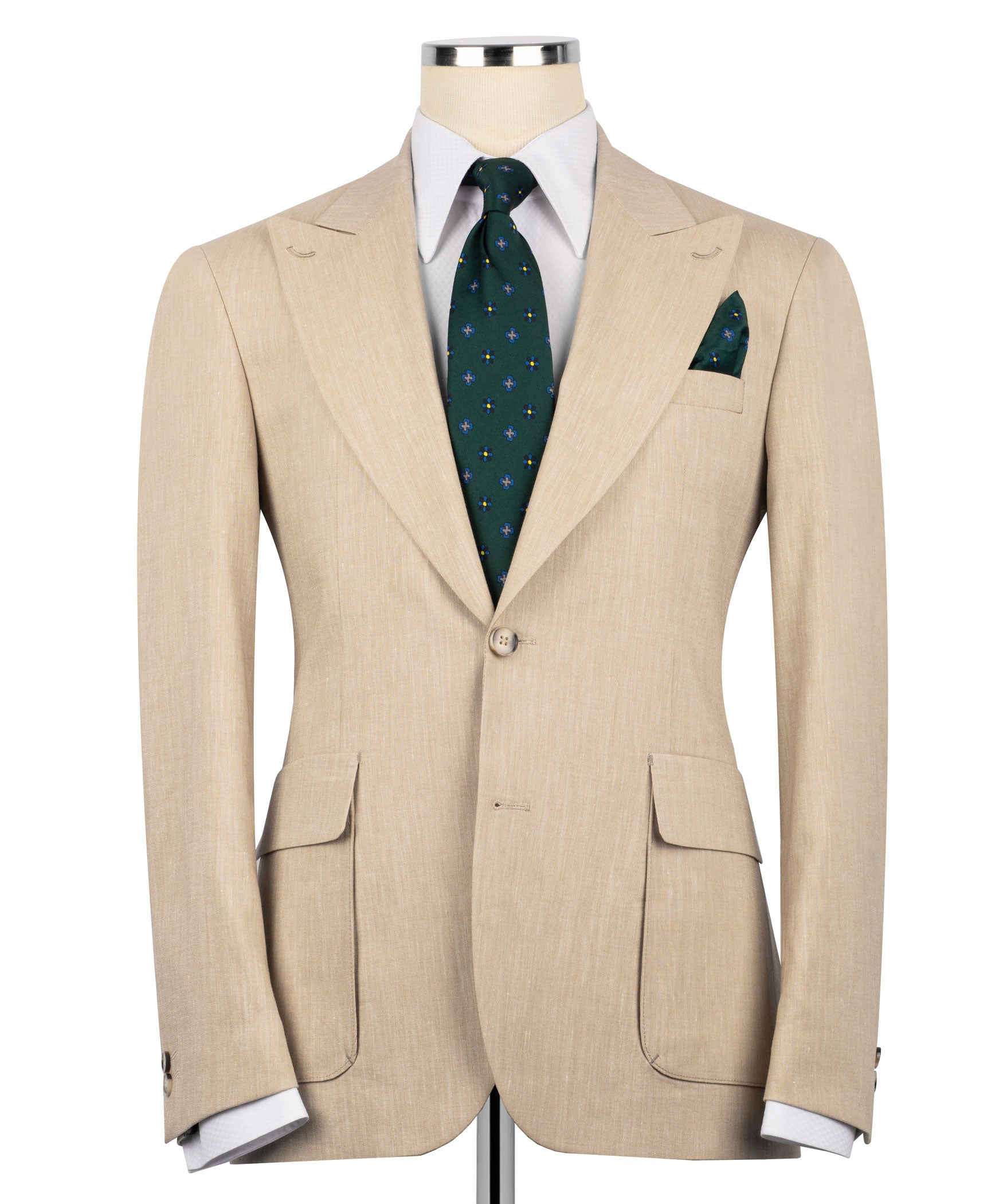 Beige linen suit jacket with flap pockets, plus green patterned tie and pocket square