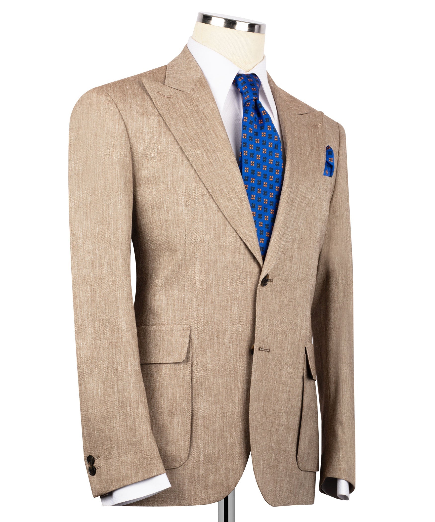 Tan linen suit jacket with peaked shoulders, flap pockets, blue tie and folded pocket square
