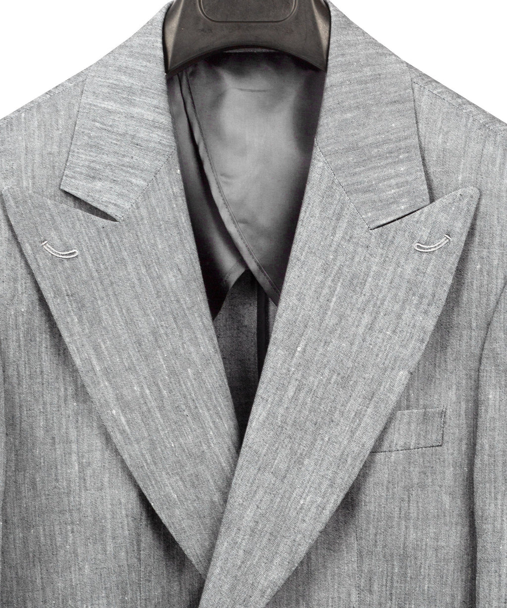 Gray linen suit jacket with open front, tie and chest pocket