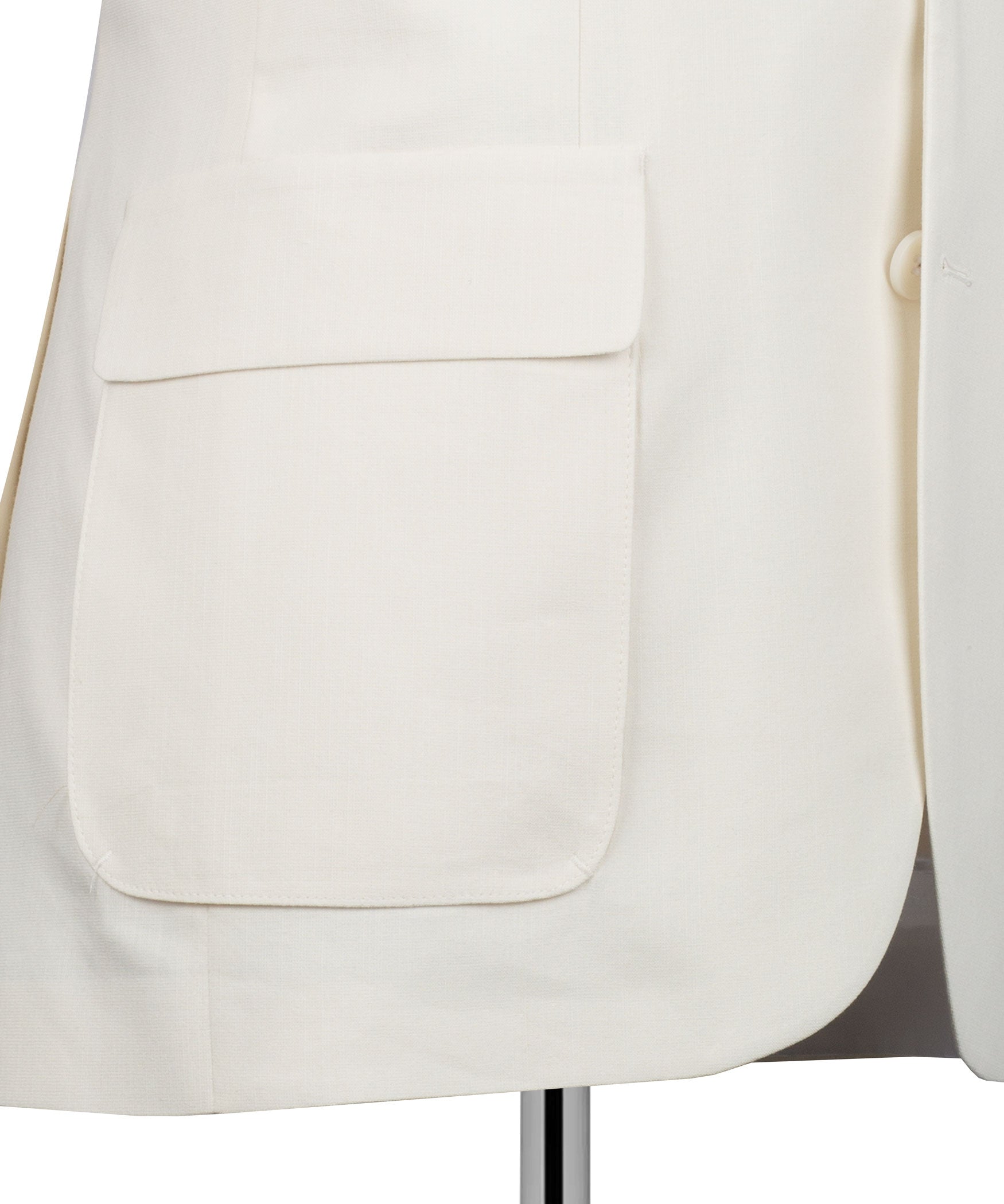 Cream linen blazer close-up of flap chest pocket and lower flap pocket