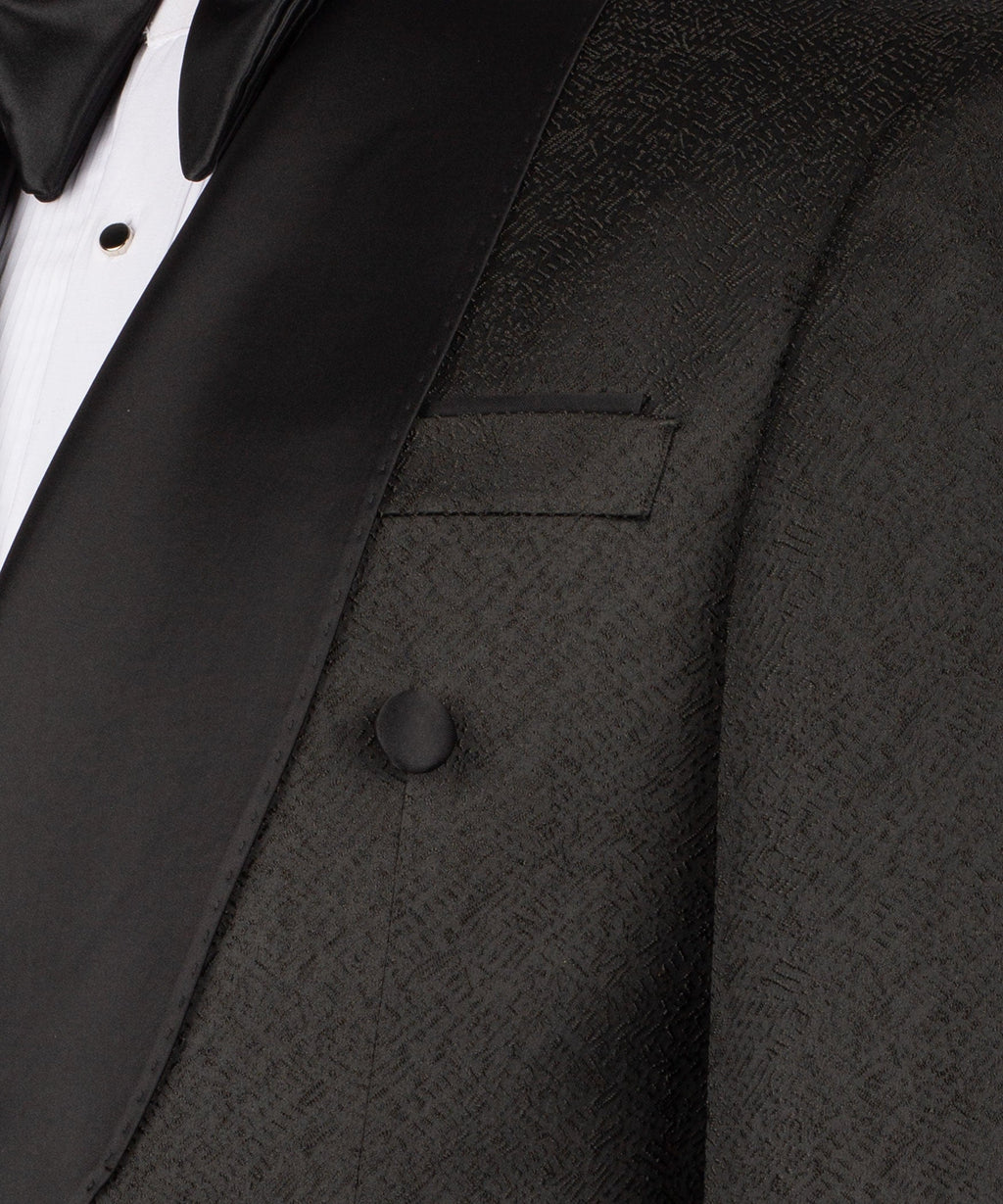 Close-up black shawl-collar tuxedo jacket and waistcoat lapel with buttons