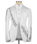 White tuxedo jacket with silver stone embroidery, bow tie, buttoned waistcoat