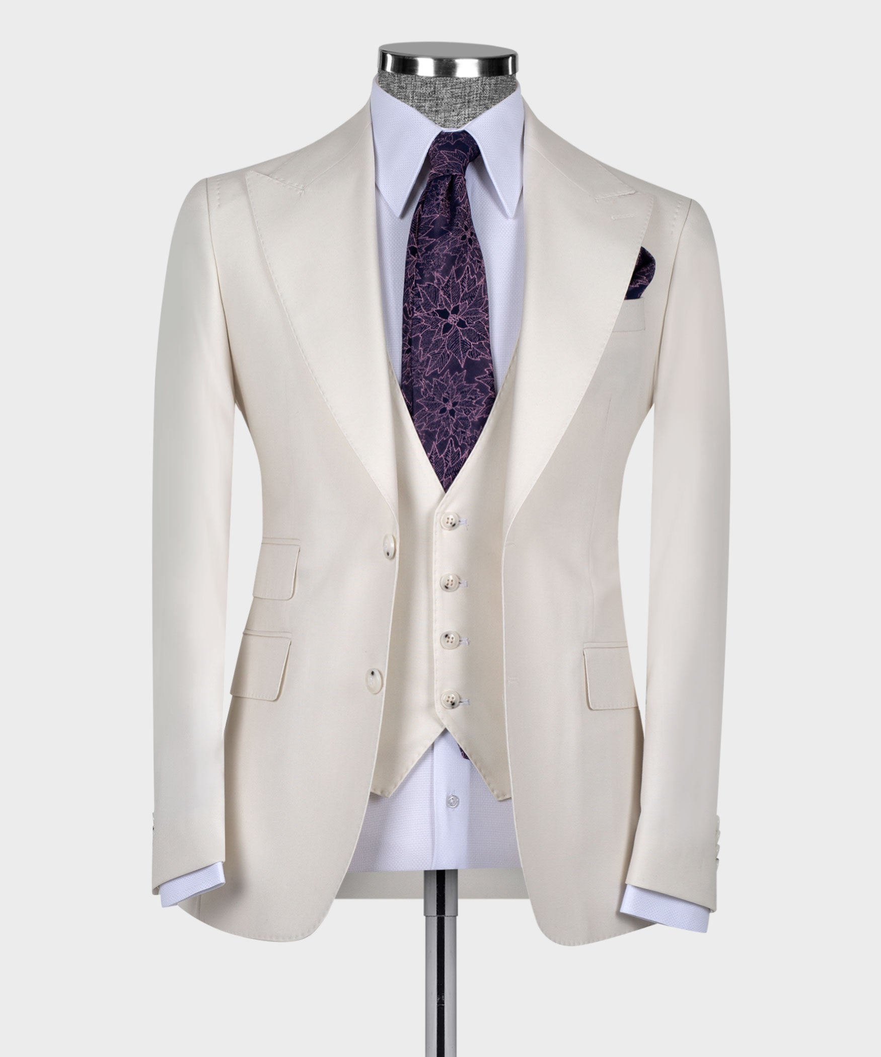 Cream tailored blazer with matching vest and purple patterned tie, front buttons and notch lapels