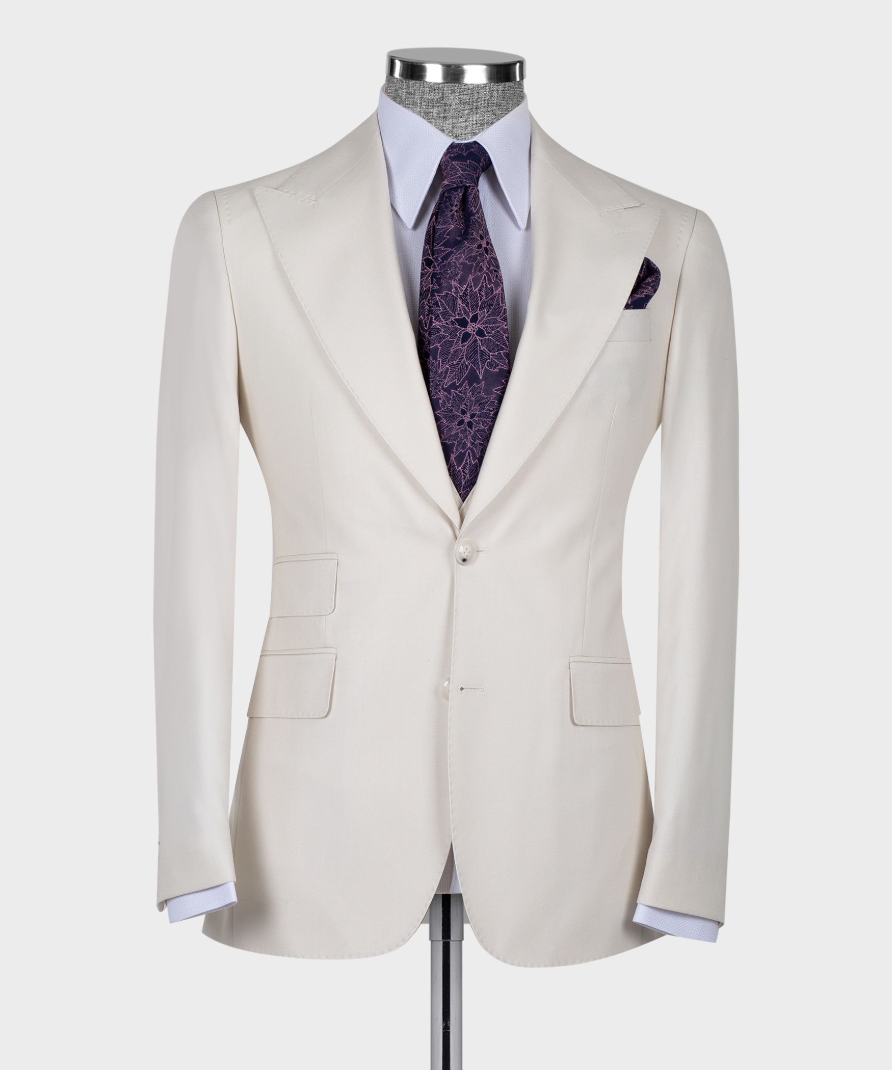 Cream blazer and vest front view on mannequin with purple patterned tie and pocket square