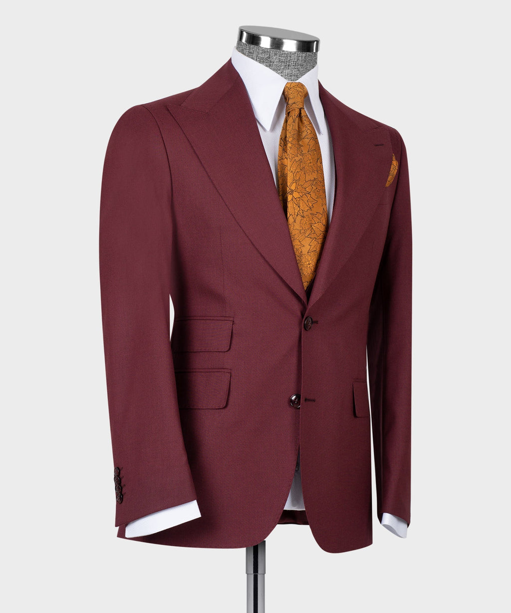 Burgundy suit jacket and vest front with buttons; mustard patterned tie