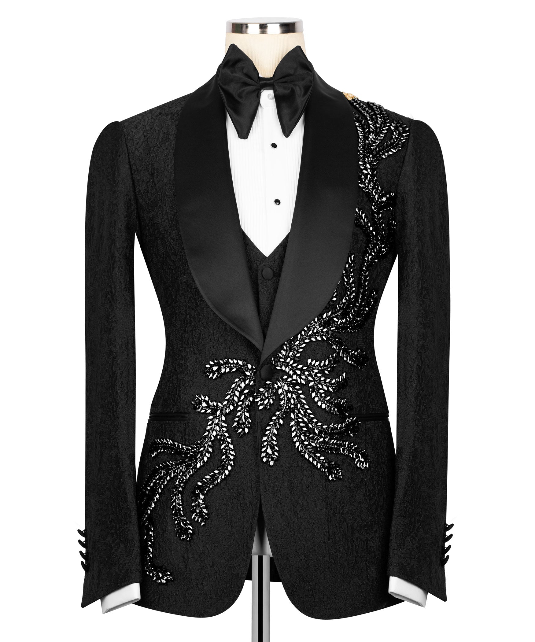 Black tuxedo jacket with embroidered stone motifs and satin lapels, bow tie