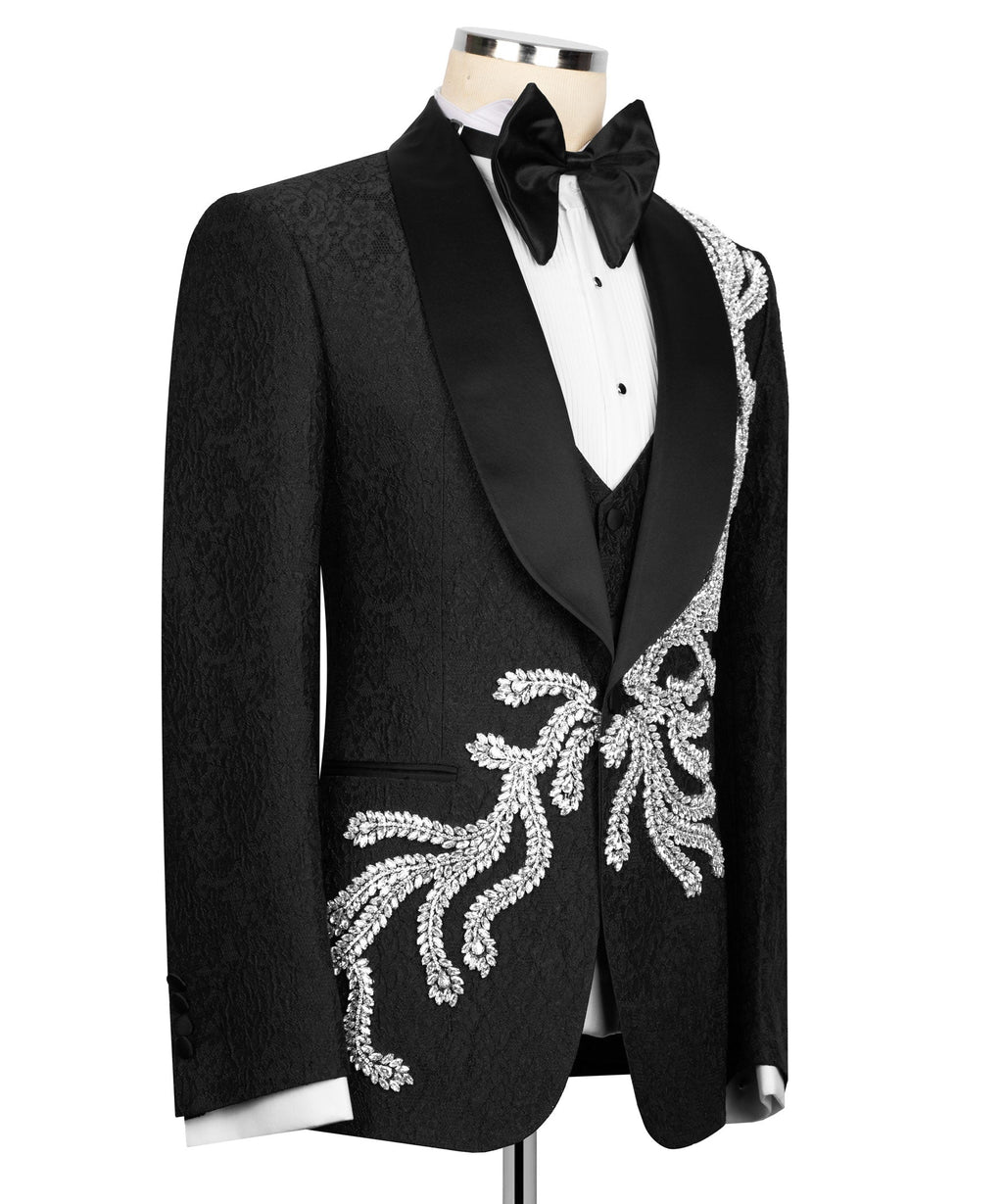 Black tuxedo jacket with satin lapels and silver beaded embroidery, styled with bow tie